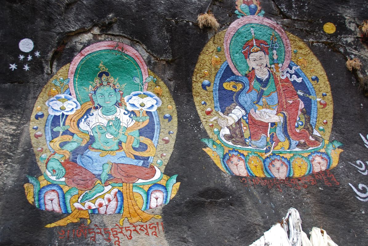 Thame 06 Paintings Of Green Tara and Padmasambhava On Rock Wall Next To Entrance Bridge To Thame